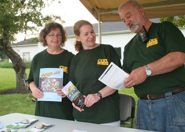 Tri Community CERT in action distributing disaster preparedness information. Photo courtesy of Kataharine Kurkov, Hillcrest Patch. See the entire story at  http://hillcrest.patch.com/articles/cert-needs-volunteers-for-disaster-response  